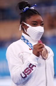 Simone Biles poses with the bronze medal during the Women's Balance Beam Final medal ceremony on day 11 of the Tokyo 2020 Olympic Games (Photo by Jamie Squire/Getty Images)